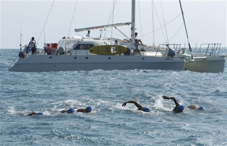 Japanese athletes swim the final stretch into the Suao harbor, northeastern Taiwan on Monday in a two-day, 95-mile swim. The athletes swam from Japan's Yonaguni Island to Taiwan to thank the island for its disaster aid after the March 11 earthquake and tsunami.